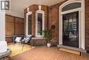 Circa 1882: This beautifully maintained home retains its original front door, complete with a classic door knocker and transom, adding to its timeless historic charm. - 132 Herkimer Street, Hamilton, ON 