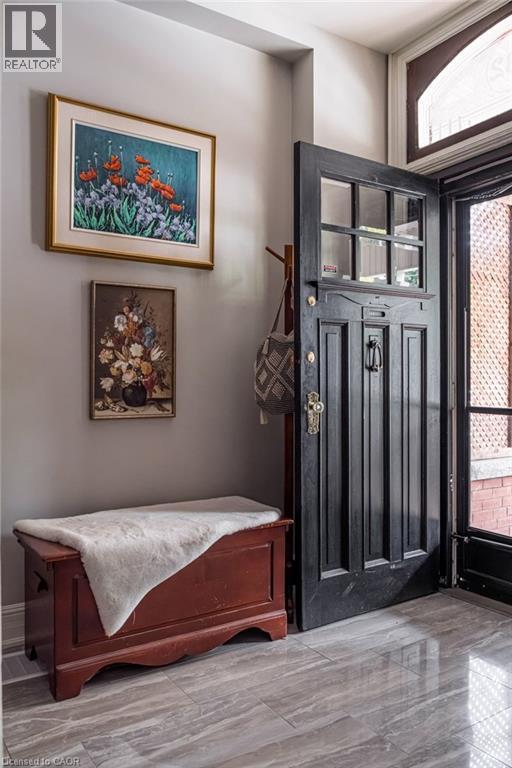 A grand foyer welcomes your guests with timeless style and grace. - 132 Herkimer Street, Hamilton, ON