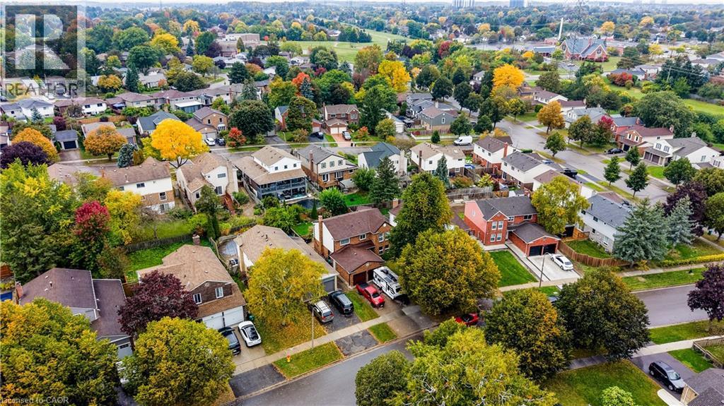 Aerial perspective of a tree-lined residential neighborhood - 104 Deerwood Crescent, Kitchener, ON