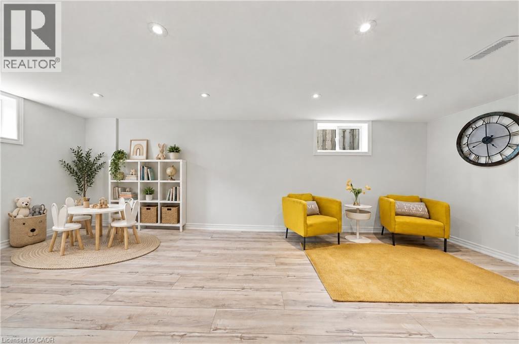 Recessed lighting, light wood-finish flooring, white walls, and multiple windows - 662 Dynes Road, Burlington, ON