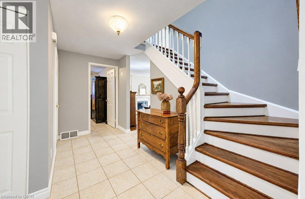Ceramic flooring and hardwood stairs - 469 Westvale Drive, Waterloo, ON