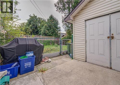 Detached structure with panel siding, double entry doors, and an overhang - 465 Herkimer Street, Hamilton, ON 