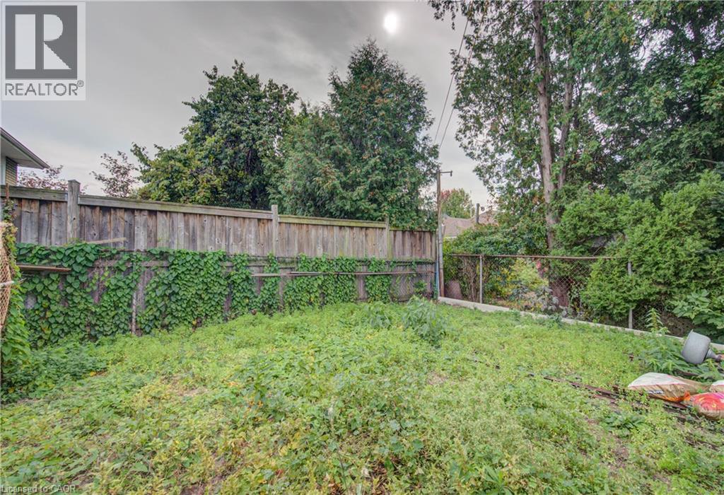 Expansive backyard space with mature trees - 465 Herkimer Street, Hamilton, ON