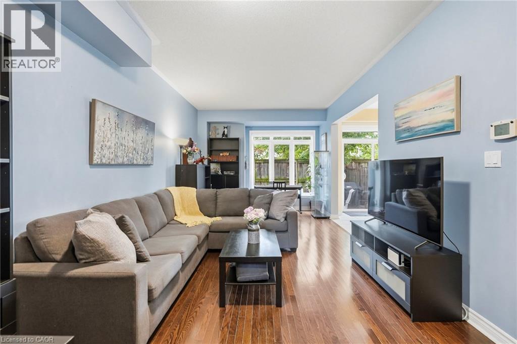 Hardwood flooring complemented by light blue walls - 1076 Ryckman Common, Burlington, ON