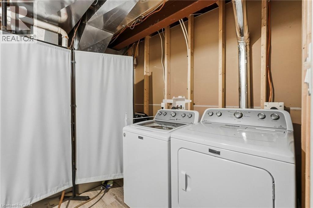 Laundry area with washer and dryer units - 1076 Ryckman Common, Burlington, ON