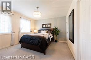 Carpeted flooring with dual windows and a flush mount ceiling light - 28 Madonna Drive, Hamilton, ON