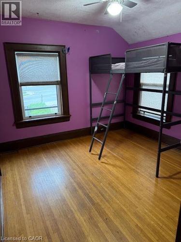 Hardwood flooring, painted walls, window with roller shade, ceiling fan - 255 Main Street, Cambridge, ON 