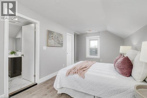 Room featuring sloped ceilings, a single window, and light gray walls - 125 Cathcart Street, Hamilton, ON 
