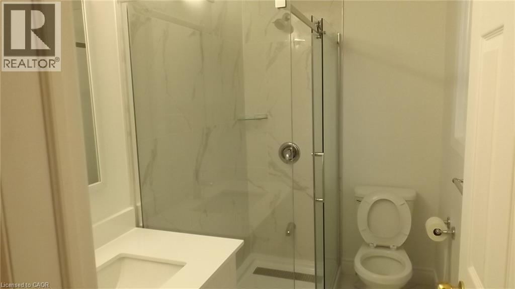 Walk-in shower with clear glass enclosure and large format wall tile - 68 Austin Drive, Waterloo, ON