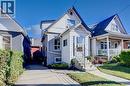 White siding exterior with a gabled roofline, front porch, concrete steps with metal railings, and a paved driveway - 3 Craigmiller Avenue, Hamilton, ON 