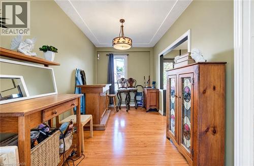 Wood-finish flooring throughout, recessed ceiling detail, and a decorative ceiling light fixture - 3 Craigmiller Avenue, Hamilton, ON 