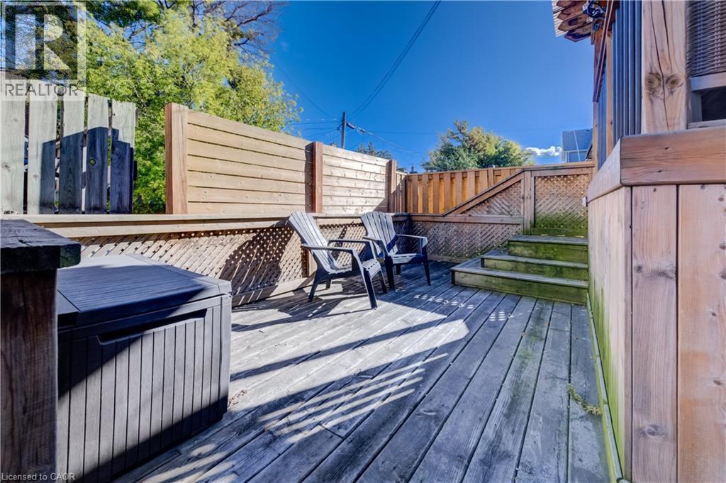 Wood-plank decking with privacy screening, lattice detailing, and built-in steps - 3 Craigmiller Avenue, Hamilton, ON