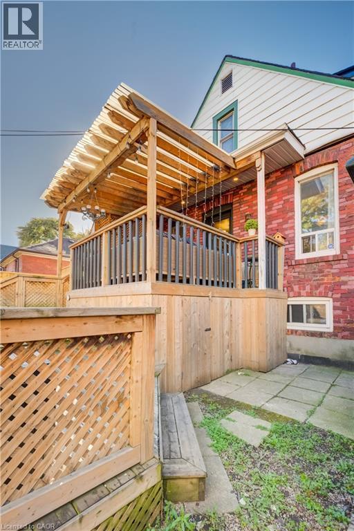 Elevated wood deck with a slatted privacy screen and an overhead pergola - 3 Craigmiller Avenue, Hamilton, ON