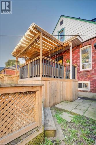 Elevated wood deck with a slatted privacy screen and an overhead pergola - 3 Craigmiller Avenue, Hamilton, ON 