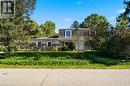 Gray exterior with white trim, featuring a distinctive Mansard roofline - 287 Blue Heron Ridge, Cambridge, ON 