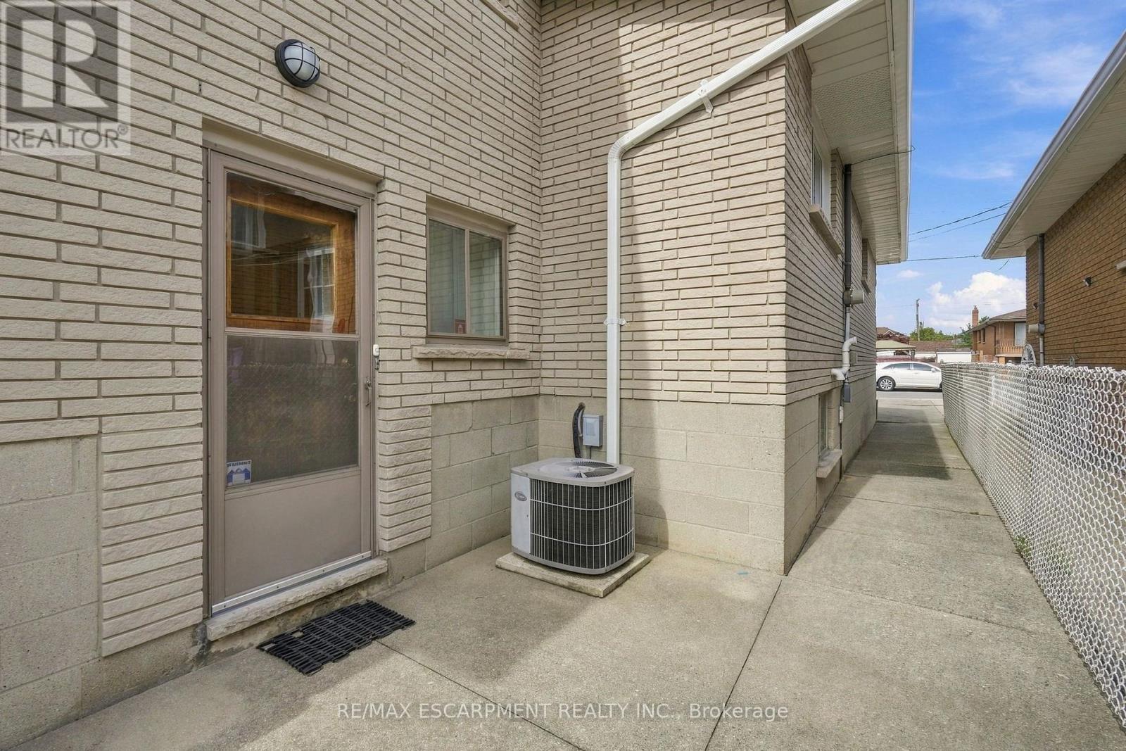 Sidewalk from frt drive to bckyrd, w/side ent - 36 Algonquin Court, Hamilton, ON