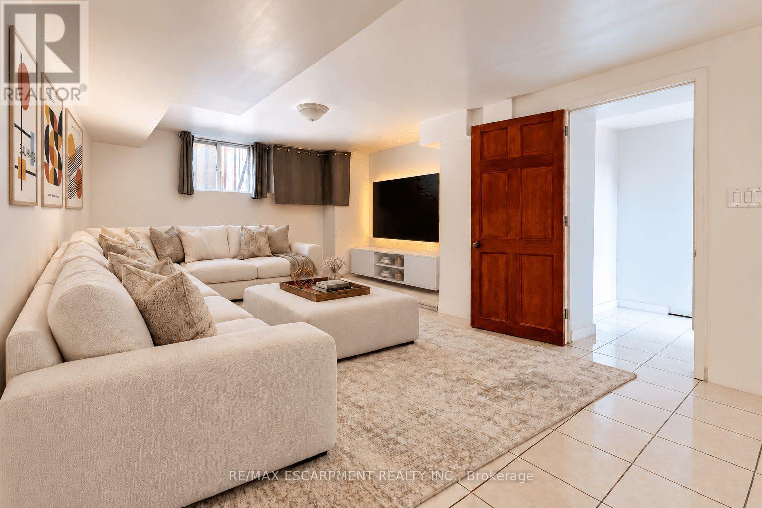 Basement Living Room Virtually Staged - 548 Beach Road, Hamilton, ON
