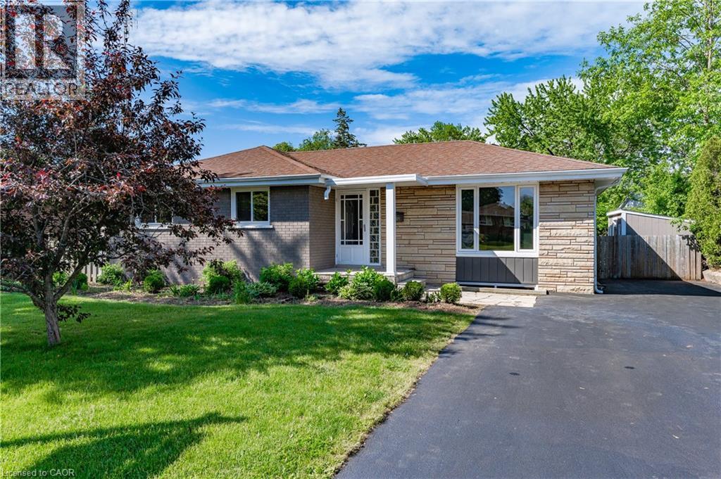 Stone and brick exterior with a front porch - 388 Appleby Line, Burlington, ON