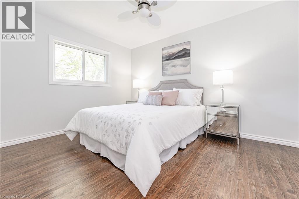 Wood-finish flooring, white walls, and a window with white trim - 388 Appleby Line, Burlington, ON