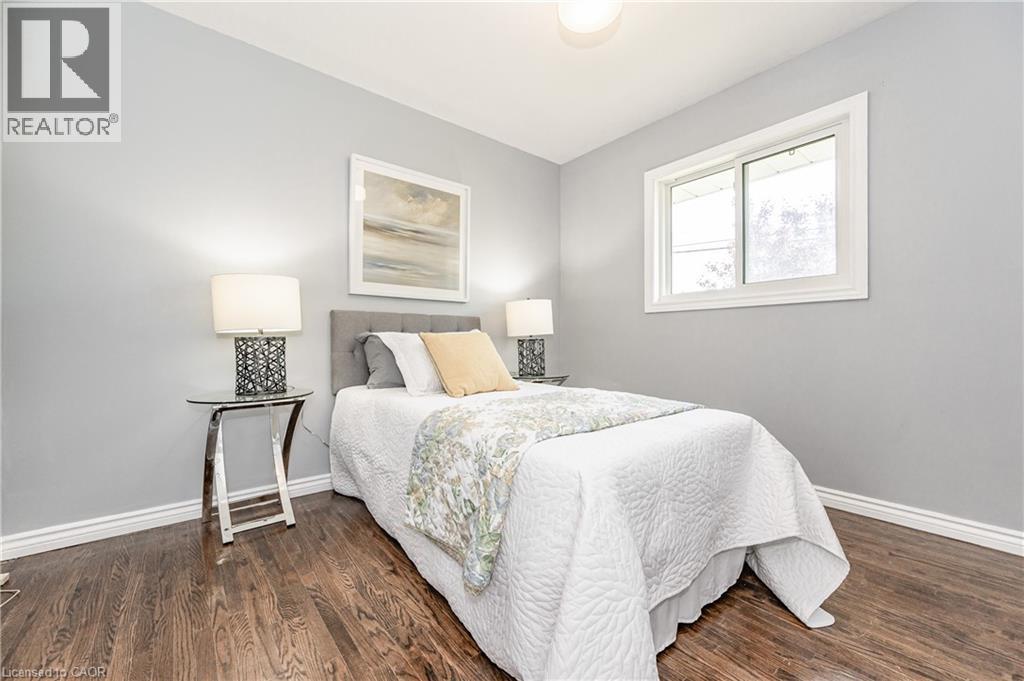 Wood-finish flooring with crisp white trim - 388 Appleby Line, Burlington, ON