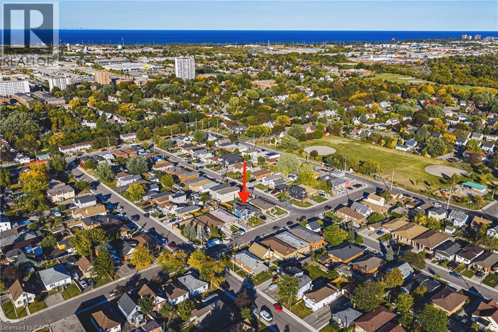 Residential neighborhood with mature trees and visible bodies of water - 1231 Dunsmure Road, Hamilton, ON