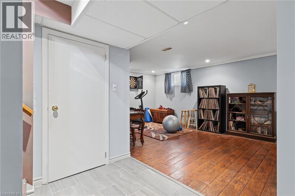 Recessed lighting, wood-finish flooring, two windows, and a drop ceiling - 366 East 17Th Street, Hamilton, ON