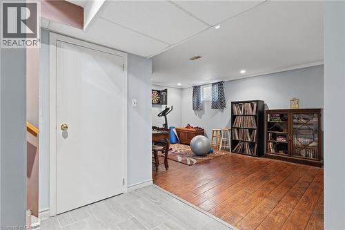 Recessed lighting, wood-finish flooring, two windows, and a drop ceiling - 366 East 17Th Street, Hamilton, ON 