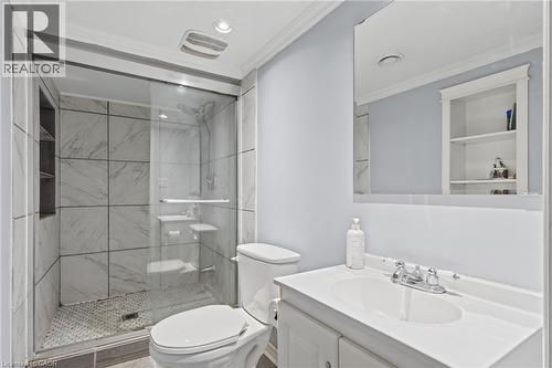 Shower with glass enclosure, large format tile walls, and a recessed niche - 366 East 17Th Street, Hamilton, ON 