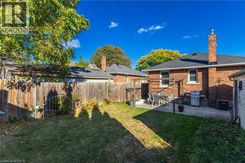 Brick exterior with a gabled roof and chimney - 366 East 17Th Street, Hamilton, ON 