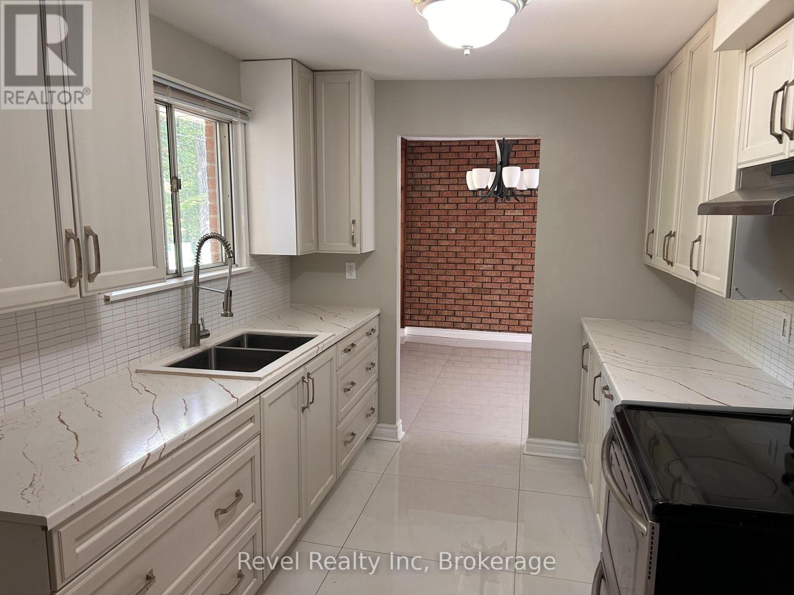 Exposed brick wall in dining area - 97 Forest Circle, Tiny, ON