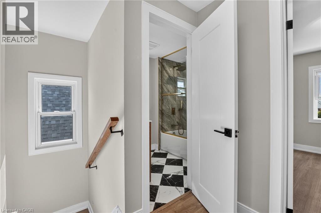White interior door with matte black hardware - 215 Paling Avenue, Hamilton, ON