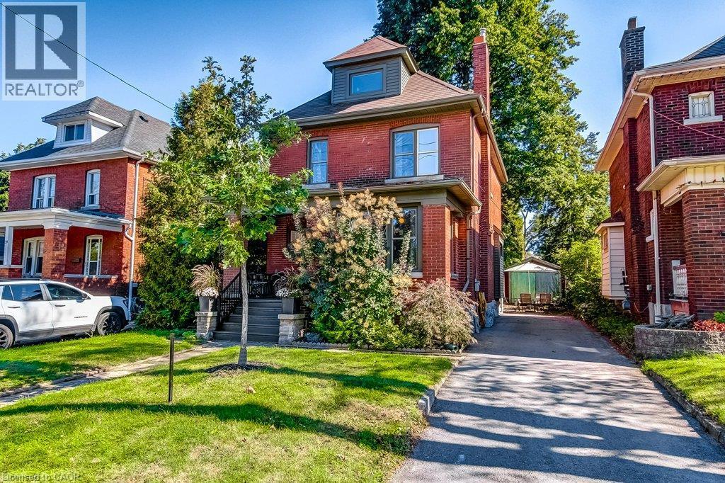 Brick exterior with a prominent chimney and dormer window - 43 Rosslyn Avenue S, Hamilton, ON