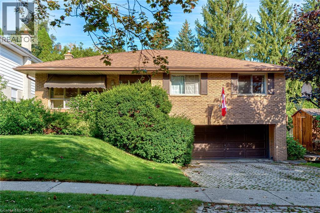 Brick exterior with brown roof shingles - 8 Bonnylyn Drive, Kitchener, ON