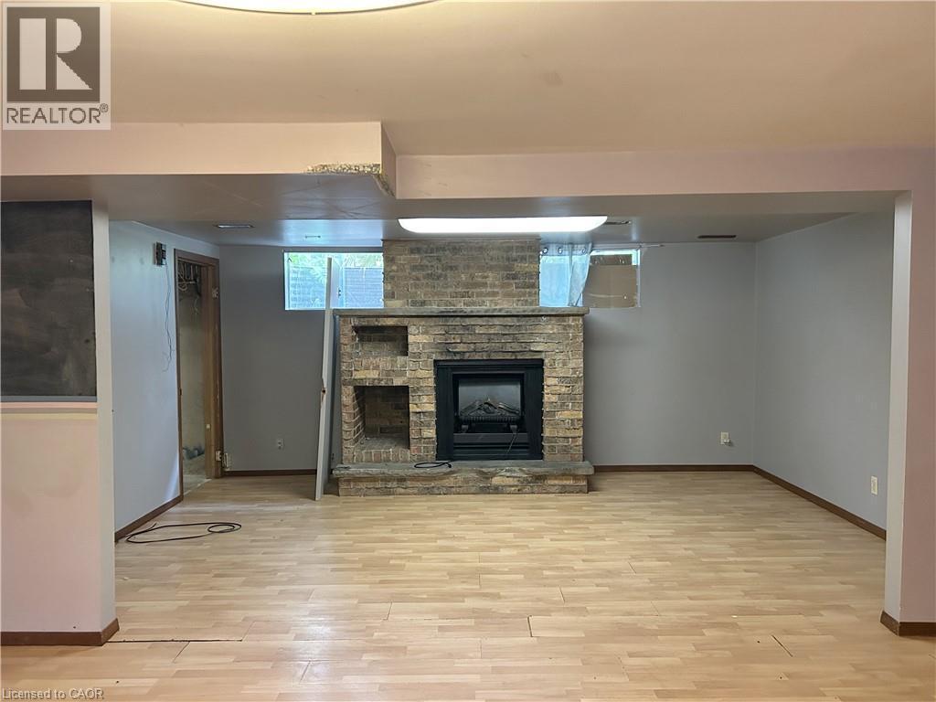 90 Queensway E, Simcoe, ON - Indoor With Fireplace