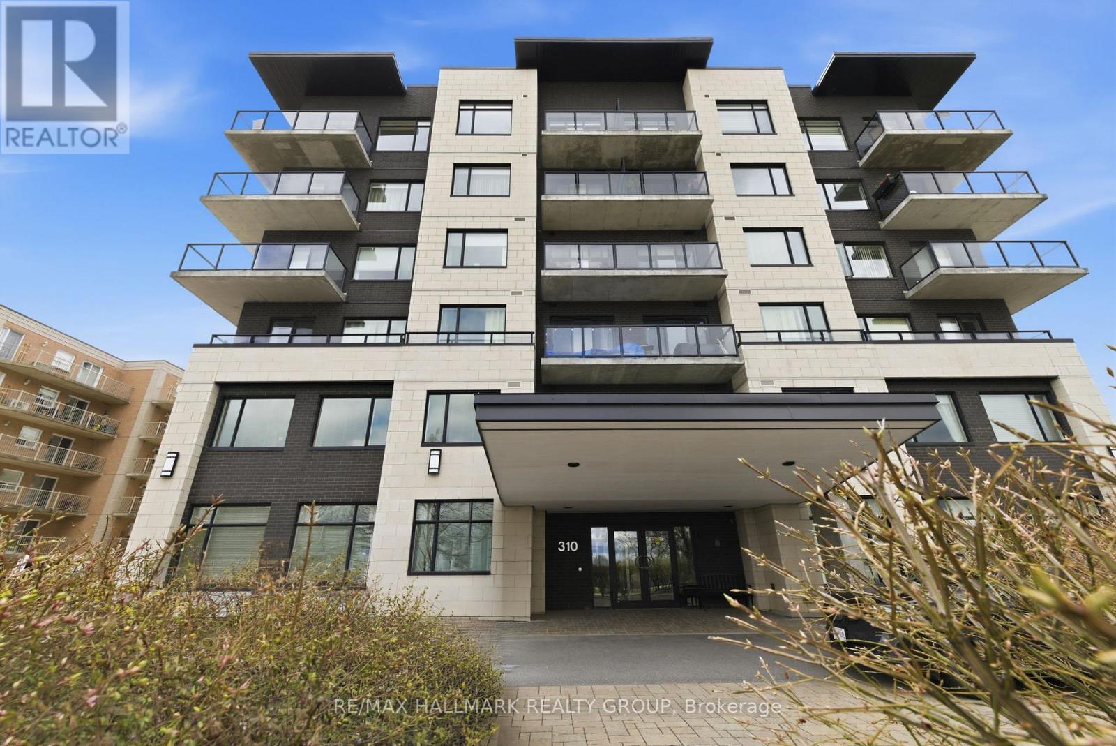 206 - 310 Centrum Boulevard, Ottawa, ON - Outdoor With Balcony With Facade