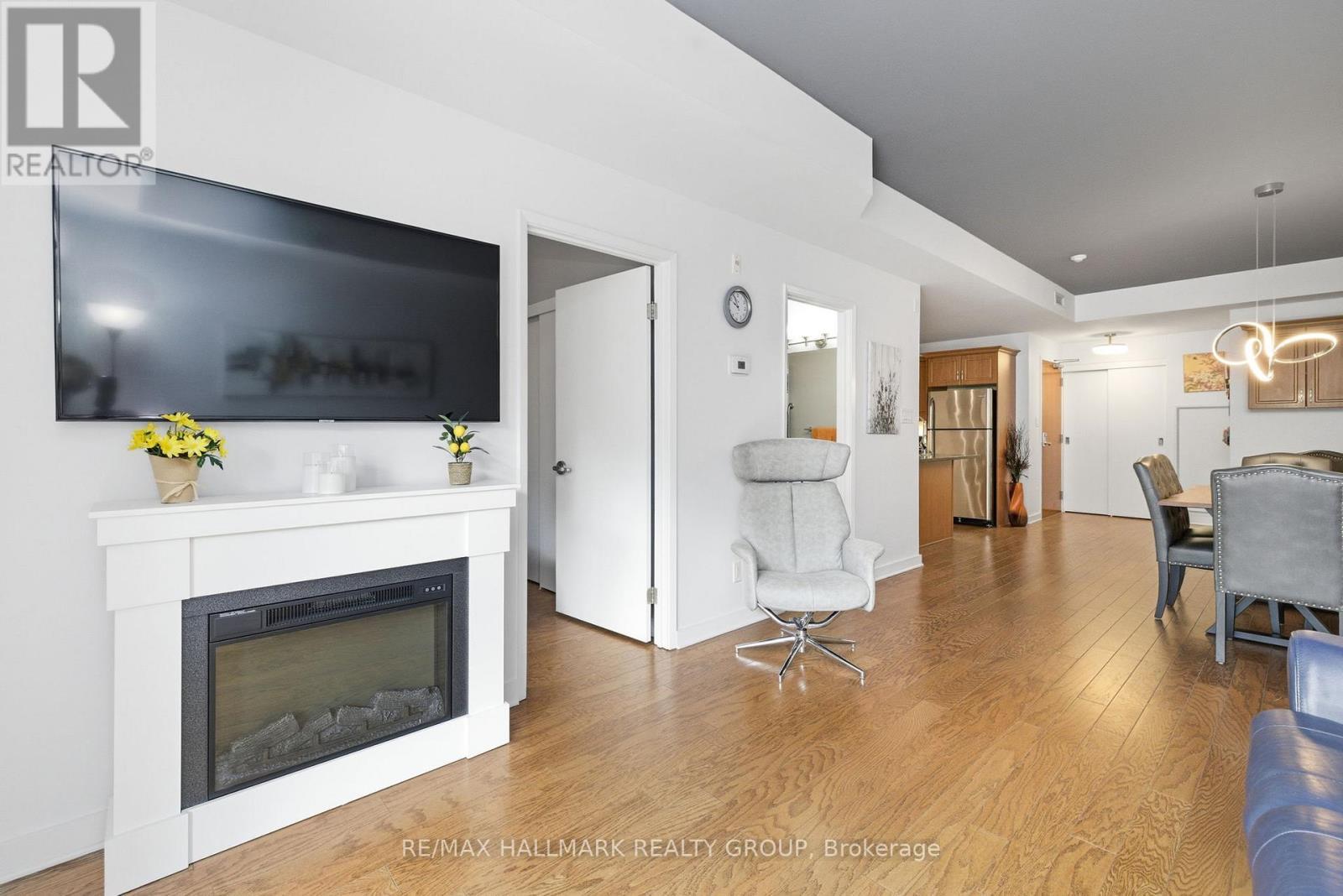 206 - 310 Centrum Boulevard, Ottawa, ON - Indoor Photo Showing Living Room With Fireplace