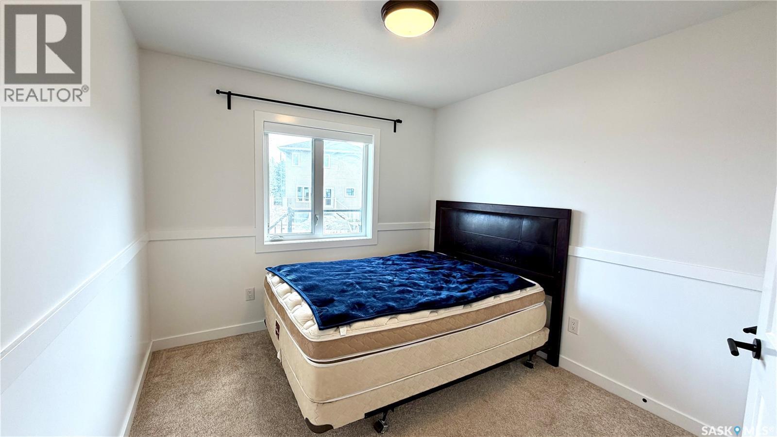 23 Chow Crescent, Outlook, SK - Indoor Photo Showing Bedroom