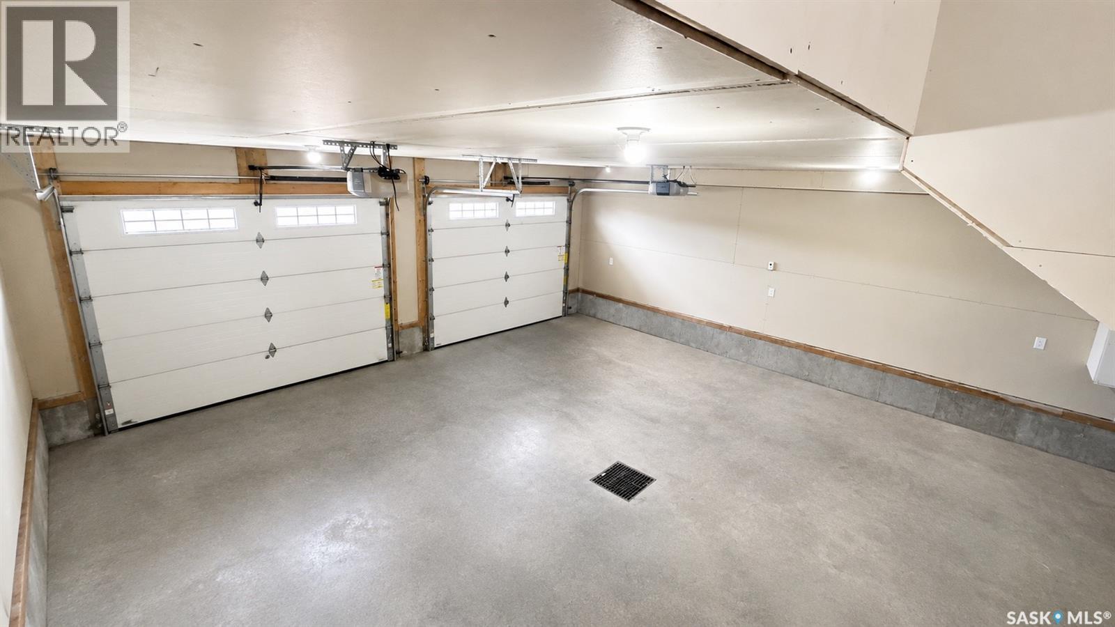 23 Chow Crescent, Outlook, SK - Indoor Photo Showing Garage