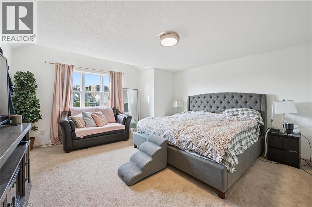 Carpeted flooring, white walls, and a multi-pane window - 765 Angler Way, Waterloo, ON - Indoor Photo Showing Bedroom