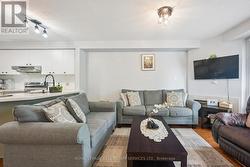 The Spacious Living Room Features a Gas Fireplace - 