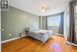 Primary Bedroom w/Walk-In Closet & Private Balcony - 