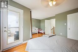 Primary Bedroom w/Walk-In Closet & Private Balcony - 