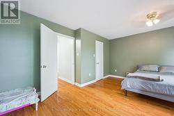 Primary Bedroom w/Walk-In Closet & Private Balcony - 