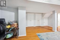 The Large Recreation Room Boasts Laminate Flooring - 