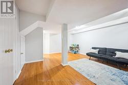 The Large Recreation Room Boasts Laminate Flooring - 