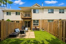 Fully Fenced Backyard with a Concrete Patio - 