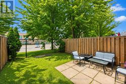 Fully Fenced Backyard with a Concrete Patio - 
