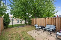 Fully Fenced Backyard with a Concrete Patio - 