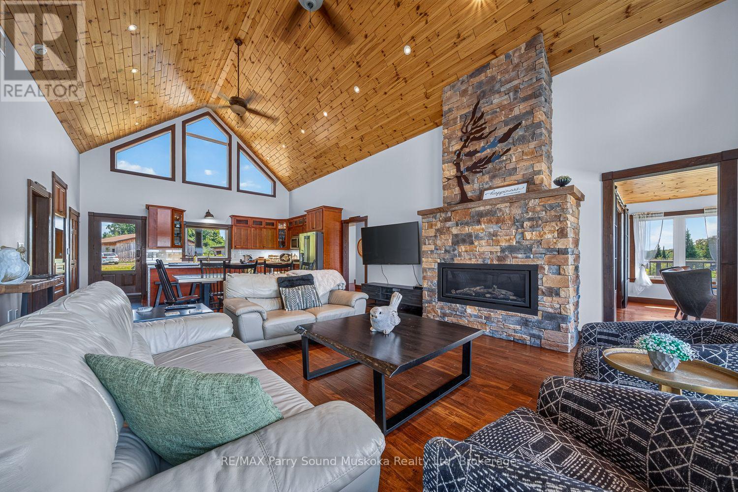 64 Mccords Road, Mckellar, ON - Indoor Photo Showing Living Room With Fireplace