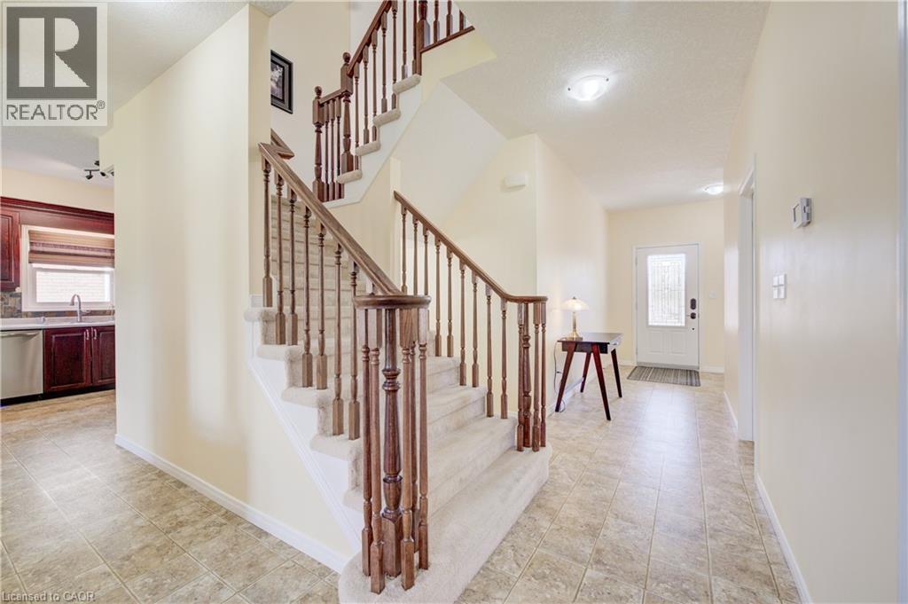 Linoleum flooring extending throughout the entryway and kitchen - 64 Kropf Drive, Baden, ON - Indoor Photo Showing Other Room